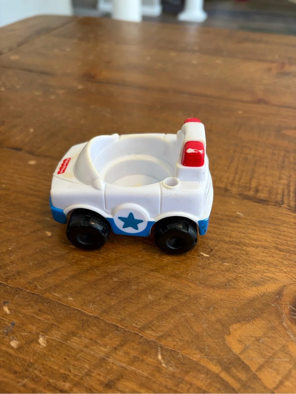 Fisher Price Little People police car as is. Has areas of yellowing see pictures